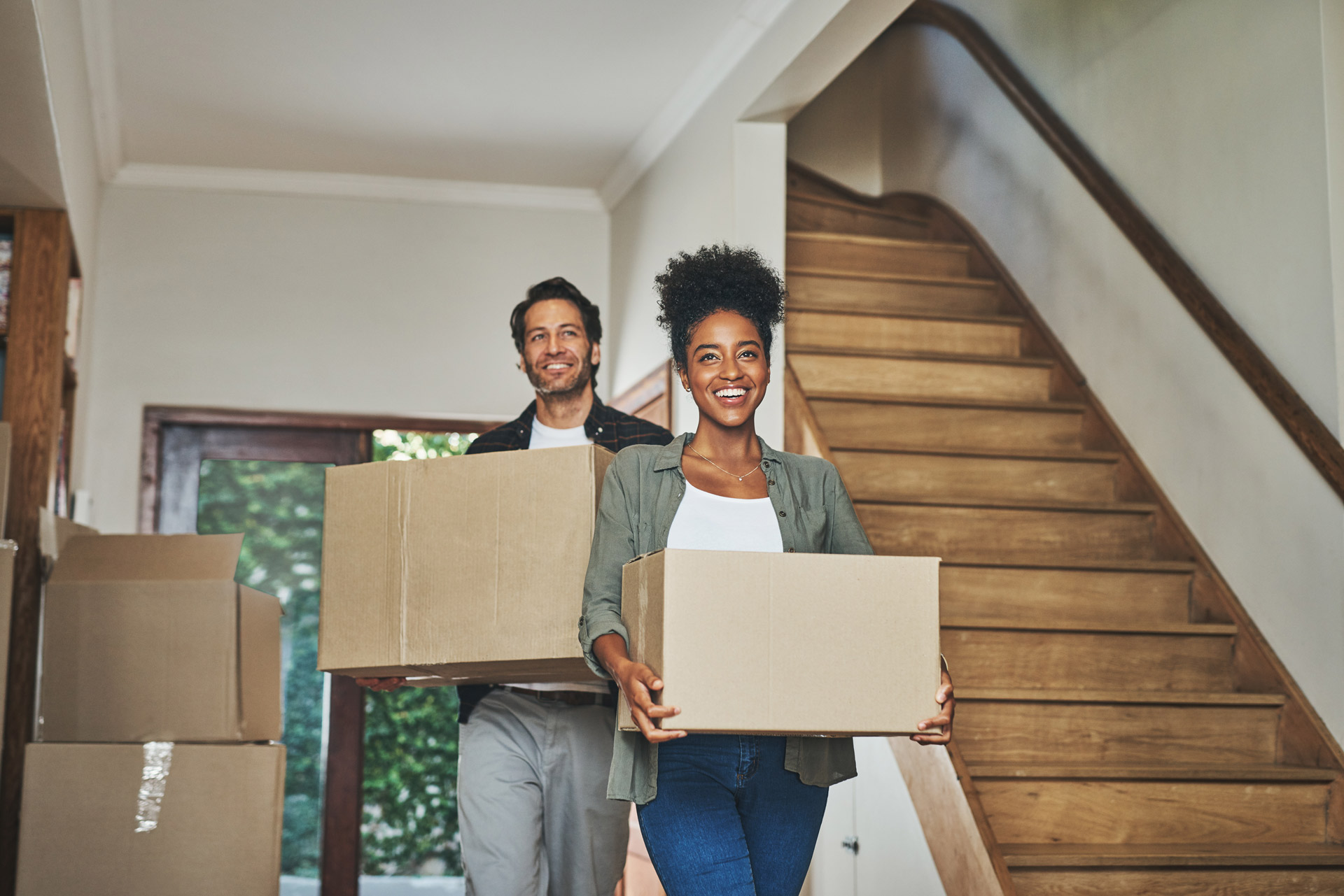 Happy Young Couple Walking into their new home